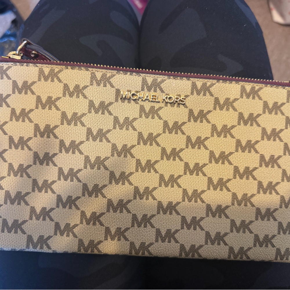 Michael Kors monogram being wristlet